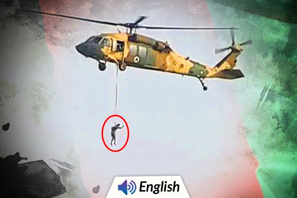 Man Hangs From Helicopter in Afghanistan